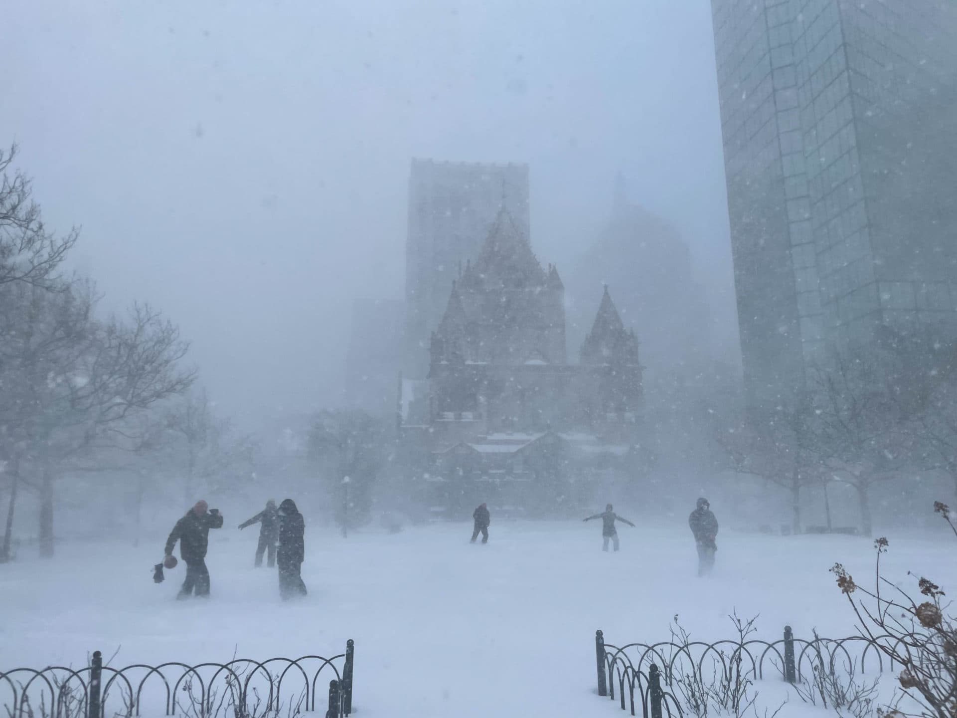 A group of people play football in front of Trinity Church in Copley Square, Saturday, Jan. 29, 2022. (Steven Davy/WBUR)