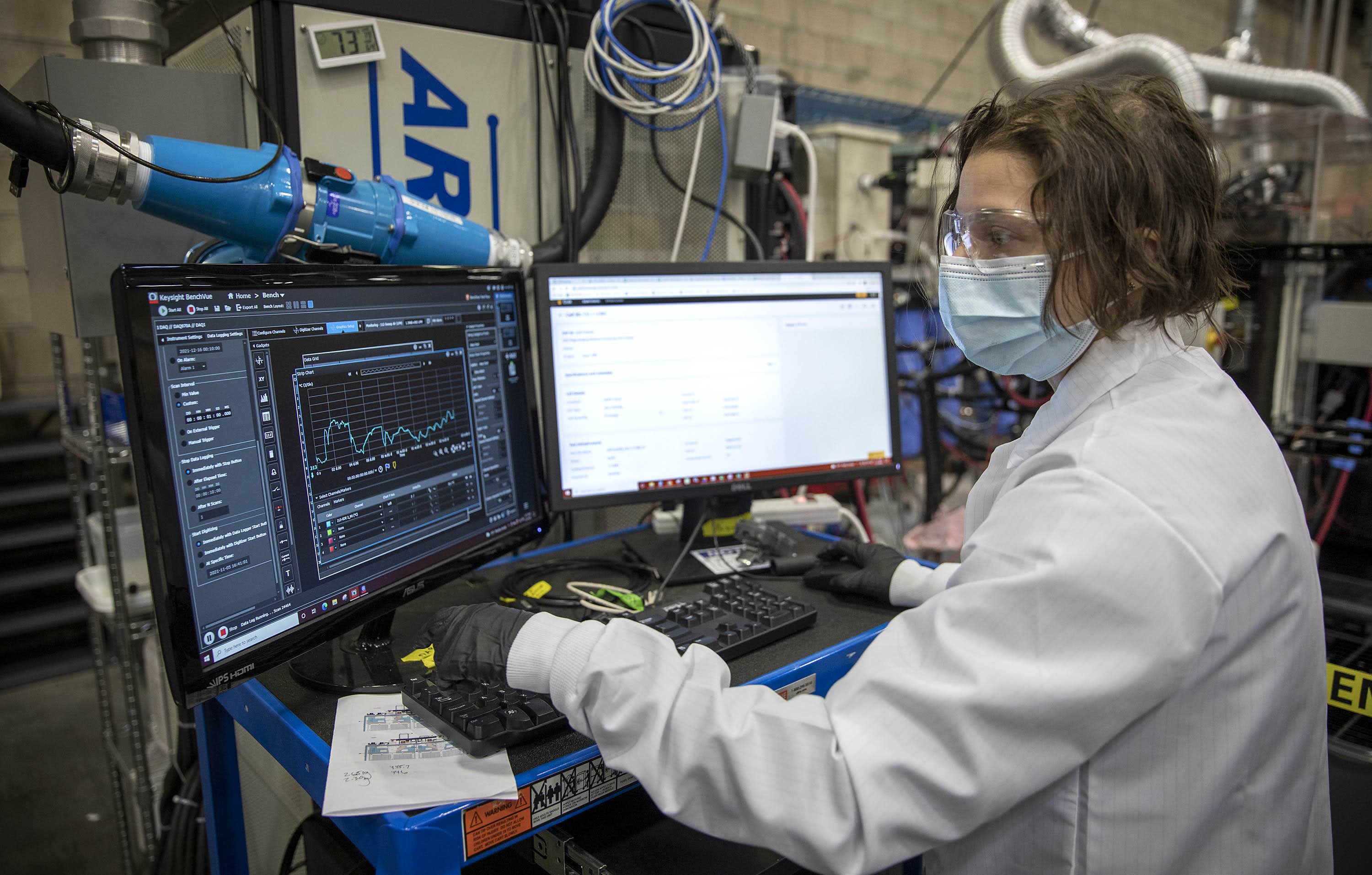 Battery engineer Amelie Kharey looks at data gathered from battery temperature testing. (Robin Lubbock/WBUR)