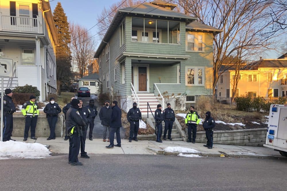 Boston police officers outside of the Roslindale home of Boston Mayor Michelle Wu. (Anthony Brooks/WBUR)