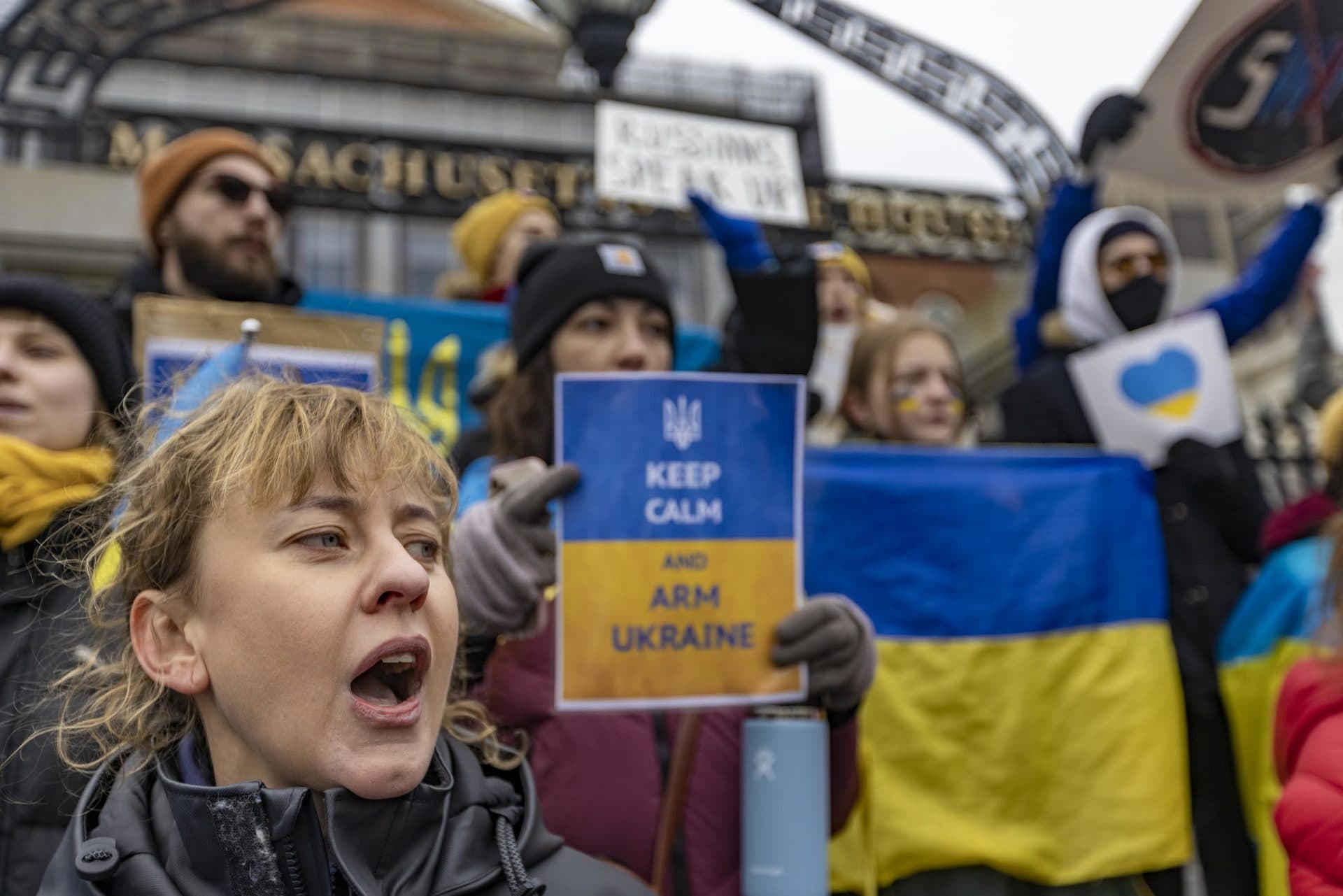 About a hundred people gathered and chanted in front of the State House for a rally to support Ukraine. (Jesse Costa/WBUR)