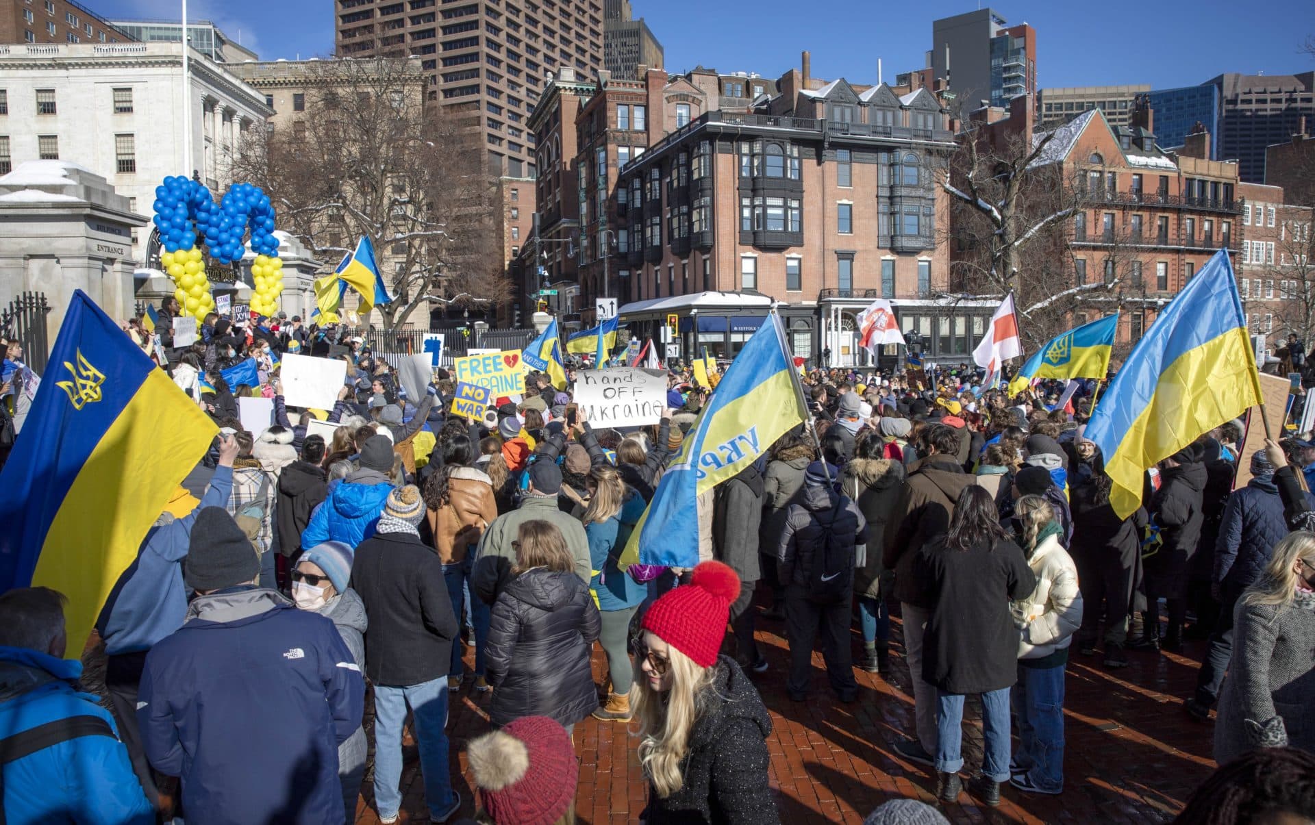 The crowd of demonstrators against the war in Ukraine filled the street in front of the Massachusetts State House, and stretched along Beacon Street and into Boston Common. (Robin Lubbock/WBUR)
