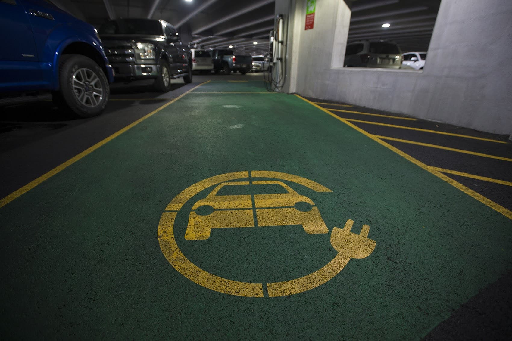 An electric car charging station in the Langsam Garage on the Boston University Campus. (Jesse Costa/WBUR)
