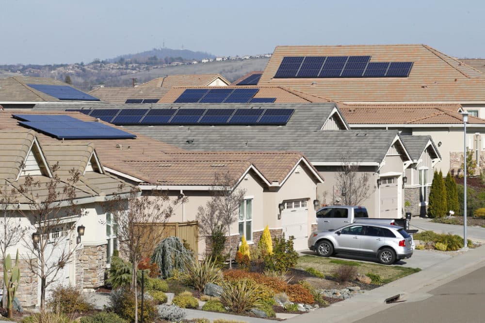 This photo taken Wednesday, Feb. 12, 2020, shows solar panels on rooftops of a housing development in Folsom, Calif. State regulators at the California Public Utilities Commission are expected to propose reforms that would lower the financial incentives for homeowners who install solar panels. (AP Photo/Rich Pedroncelli, File)