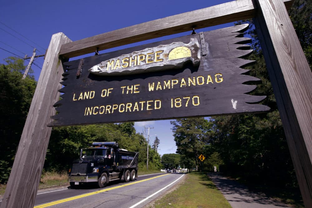 A wooden sign notes the location of Mashpee Wampanoag tribal lands in Massachusetts. (Steven Senne/AP)