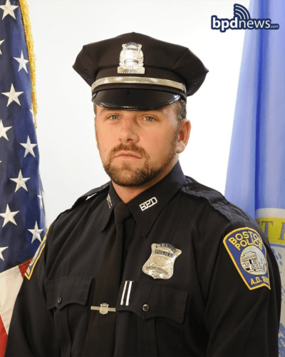This undated photograph provided by the Boston Police Department shows officer John O'Keefe, 46, of Canton, Mass. O'Keefe died at an area hospital after being found lying in snow unresponsive outside his home on Jan. 30, 2022. (Boston Police Department via AP)