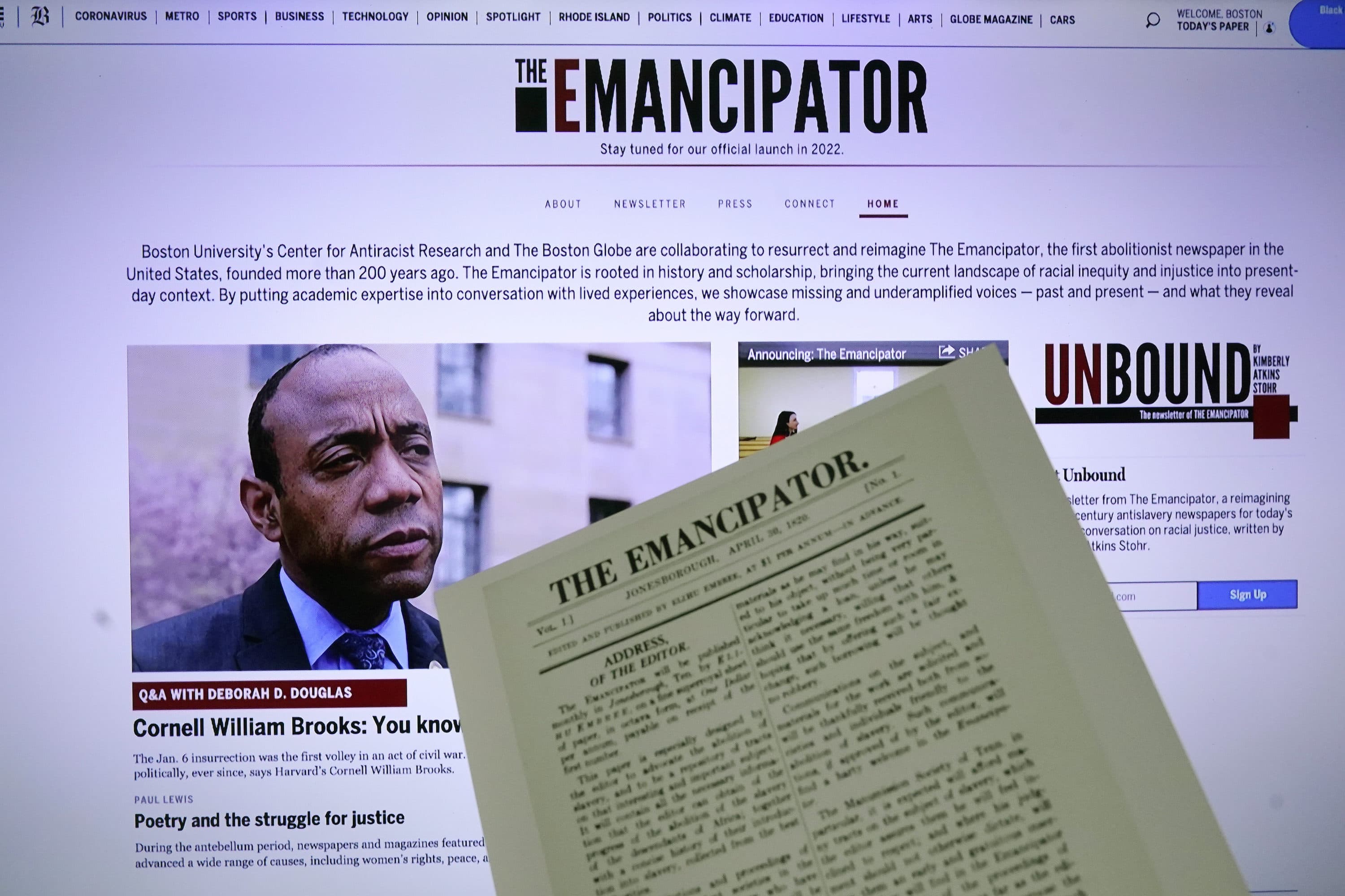 The new online publication of &quot;The Emancipator&quot; is pictured with a copy of the April 30, 1820, first edition of &quot;The Emancipator&quot;, Feb. 2, 2022, in Boston. (AP Photo/Charles Krupa)