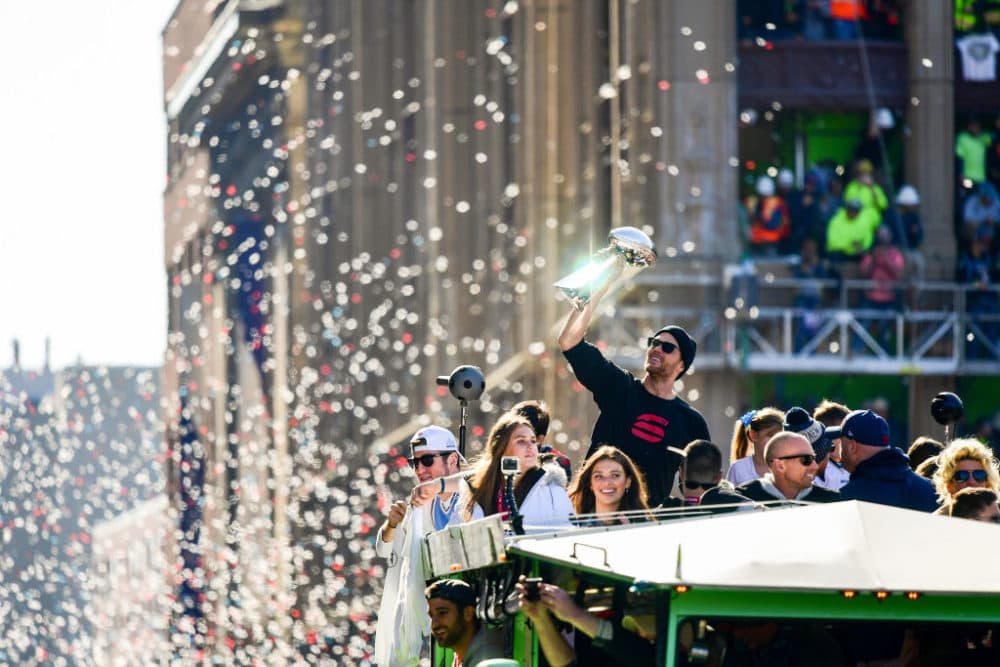 Tom Brady #12 of the New England Patriots reacts as he holds the Vince Lombardi trophy during the Super Bowl Victory Parade on February 05, 2019 in Boston, Massachusetts. (Billie Weiss/Getty Images)