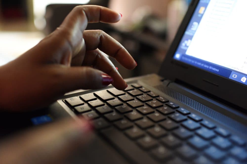 A woman uses a laptop. (Issouf Sanogo/AFP via Getty Images)