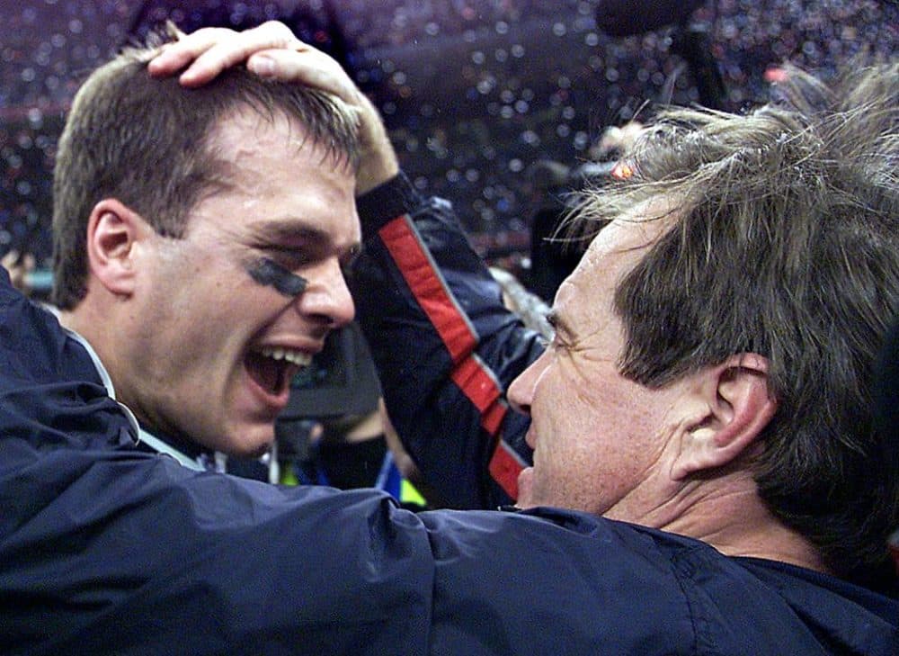 New England Patriots' quarterback Tom Brady celebrates with head coach Bill Belichick (R) after their win over the St. Louis Rams 03 February, 2002 in Super Bowl XXXVI in New Orleans, Louisiana. (Jeff Haynes/AFP via Getty Images)