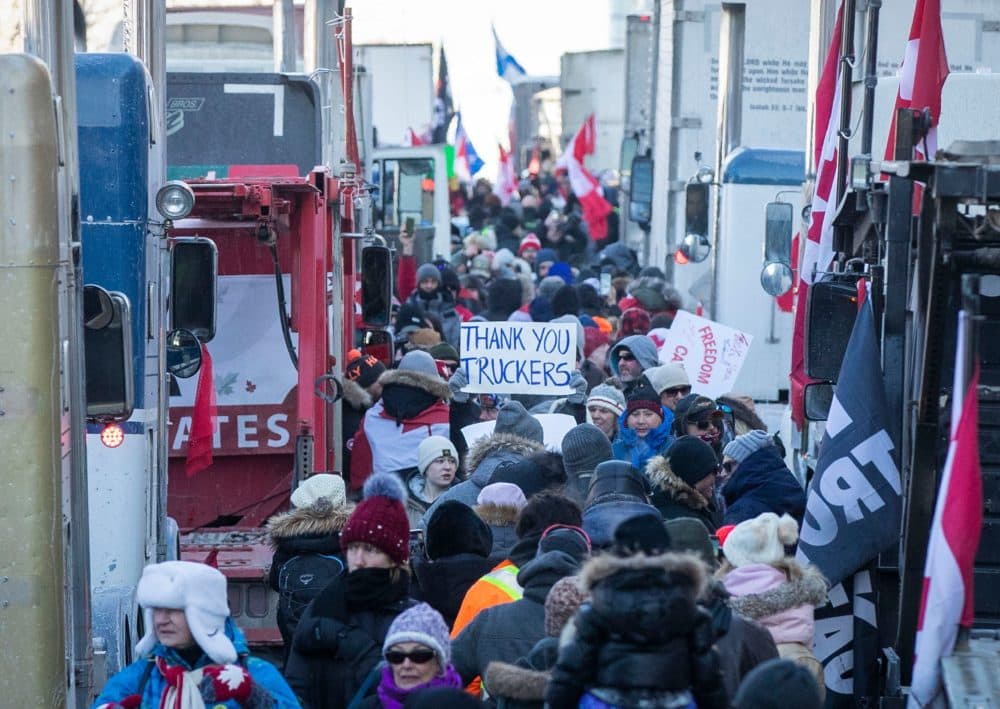 Supporters arrive at Parliament Hill for the Freedom Truck Convoy to protest against Covid-19 vaccine mandates and restrictions in Ottawa, Canada, on Jan. 29, 2022. (Lars Hagberg/AFP via Getty Images)