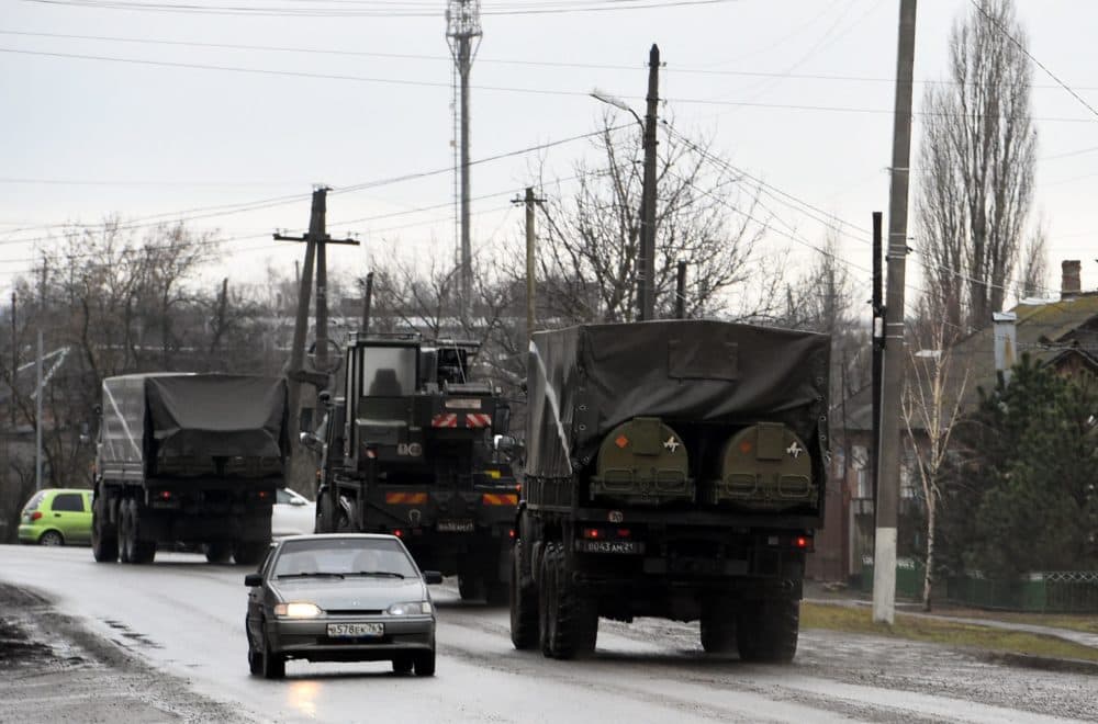 Russian military vehicles move on a road in the southern Russian Rostov region on Feb. 24, 2022. Russian President Vladimir Putin launched a full-scale invasion of Ukraine on Thursday, killing dozens and triggering warnings from Western leaders of unprecedented sanctions. Russian air strikes hit military installations across the country and ground forces moved in from the north, south and east, forcing many Ukrainians flee their homes to the sounds of bombing. (Stringer/AFP via Getty Images)