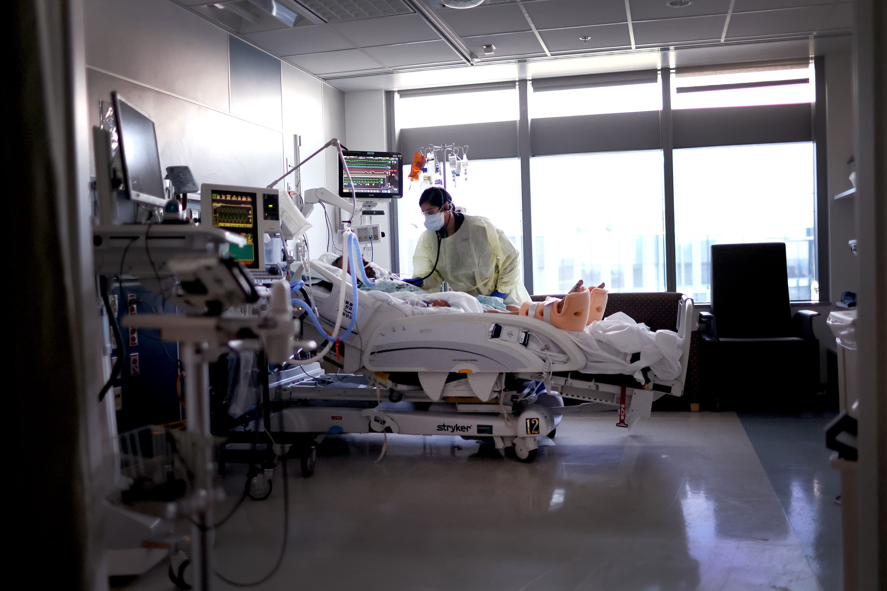 Respiratory Therapist Nirali Patel works with a COVID-19 patient in the ICU at Rush University Medial Center on Jan. 31, 2022 in Chicago, Illinois. (Scott Olson/Getty Images)