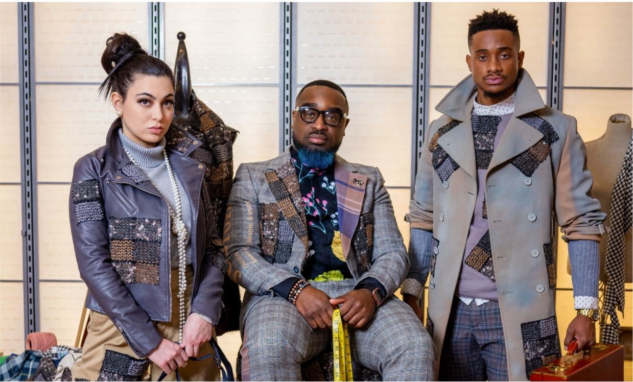 Justin Haynes, center, with two models showing pieces from his most recent ONYX collection.