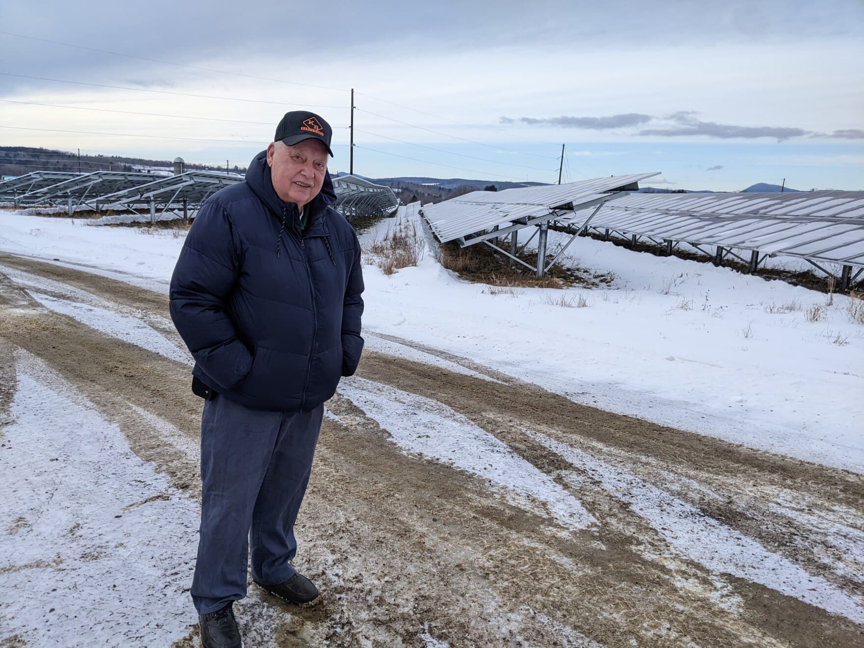 Bussie York helps run a Farmington farm that's been in his family for decades. The business now has 300,000 solar panels on it, which is thought to the biggest solar array in New England. (Robbie Feinberg/Maine Public)