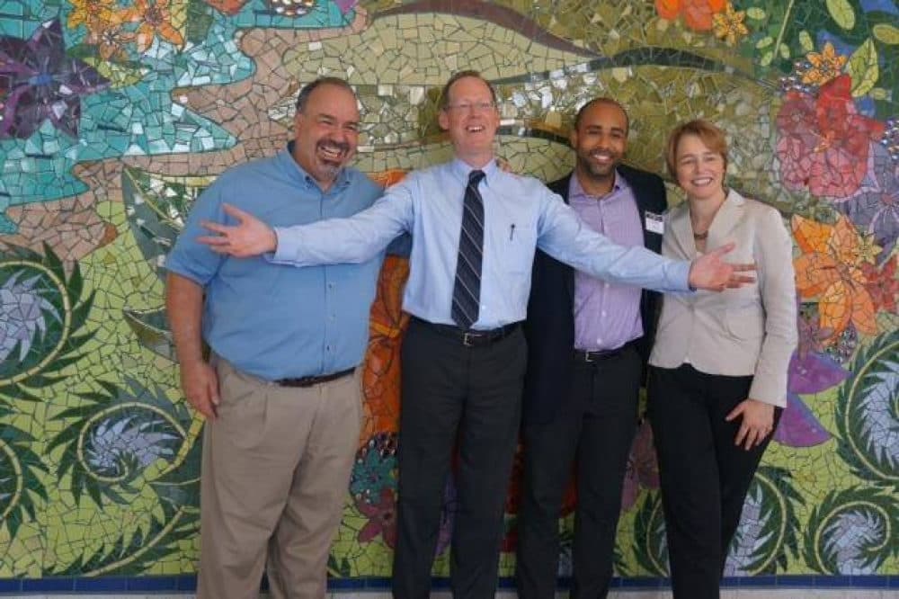 From left, Jim Ansara, Paul Farmer, David Walton and Ophelia Dahl, PIH co-founder, pictured at the opening of Hôpital Universitaire de Mirebalais in 2013. (Courtesy of Jim Ansara)