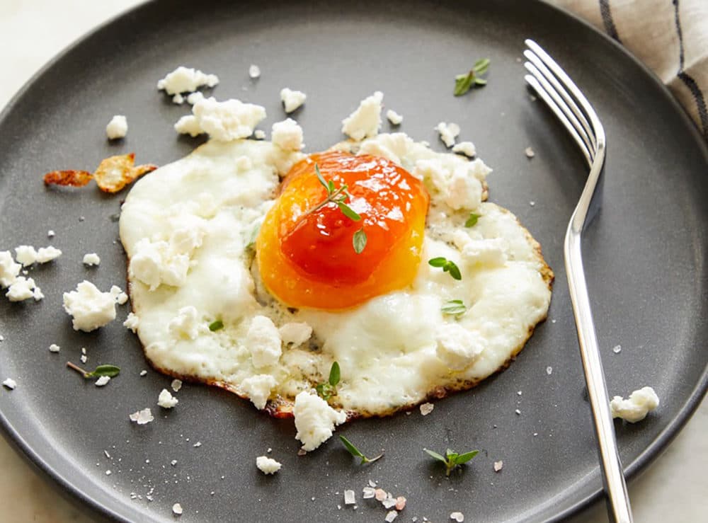 Fried eggs with apricot jam and goat cheese from &quot;The Fresh Eggs Daily Cookbook&quot; by Lisa Steele. (Tina Rupp)