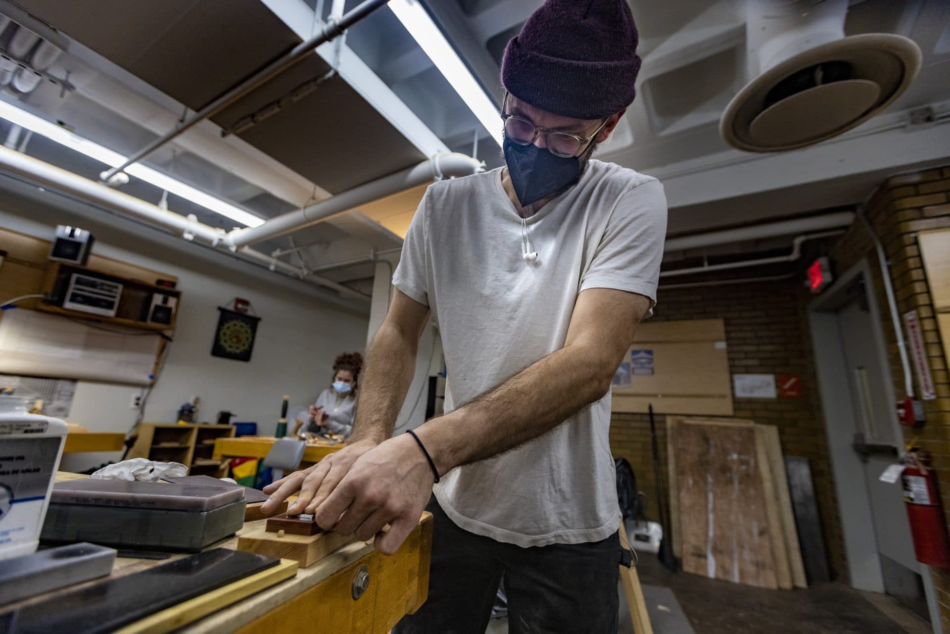 David Clarke sharpens the blade of a shoulder plane in the Bench Room at North Bennet Street School. Clarke hopes to start fresh as a woodworker after spending years in the restaurant industry, (Jesse Costa/WBUR)