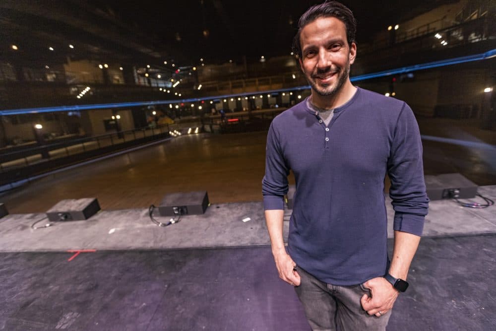 Josh Bhatti, vice president of the Bowery Presents Boston, stands on the stage at Roadrunner. (Jesse Costa/WBUR)
