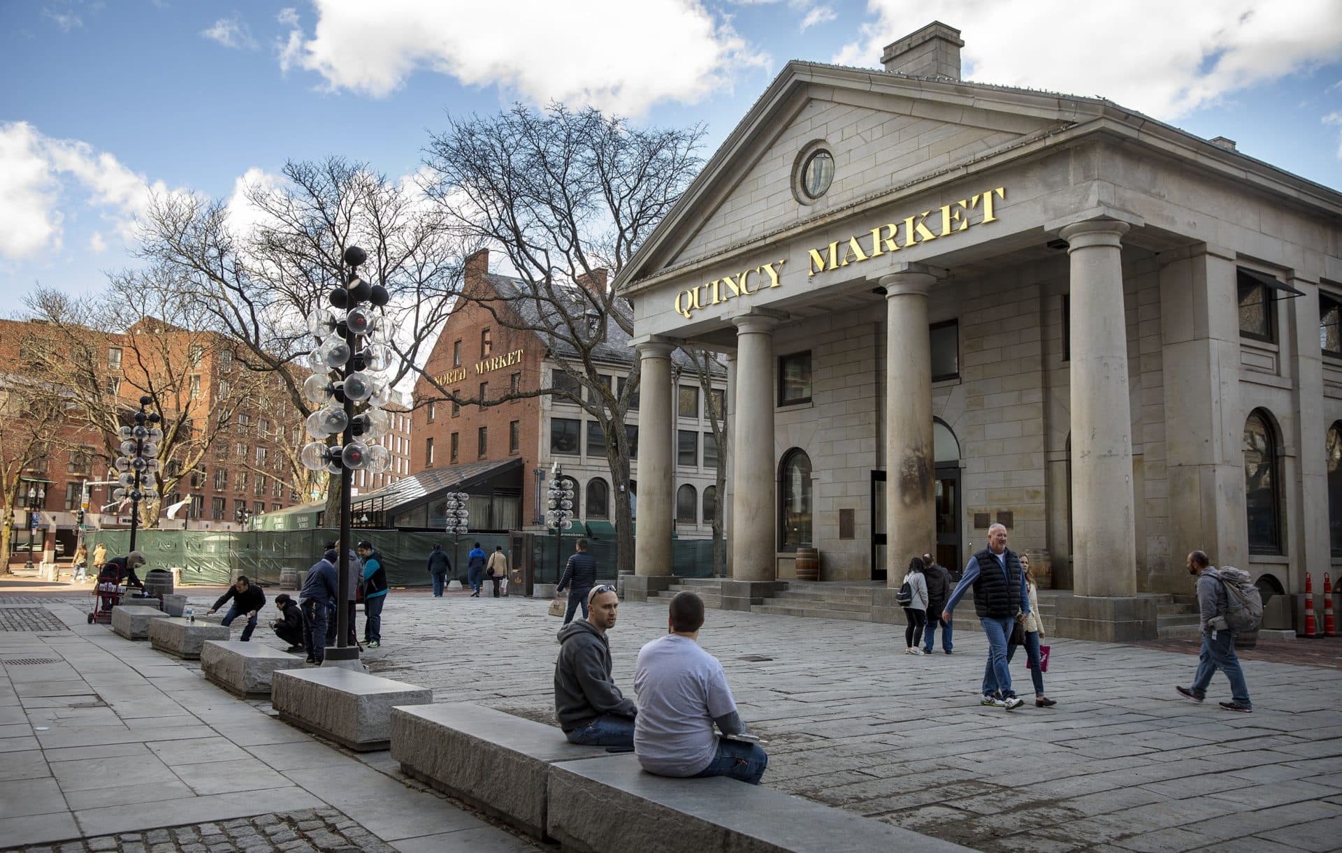 Visitor outside at Faneuil Hall Marketplace. (Robin Lubbock/WBUR)