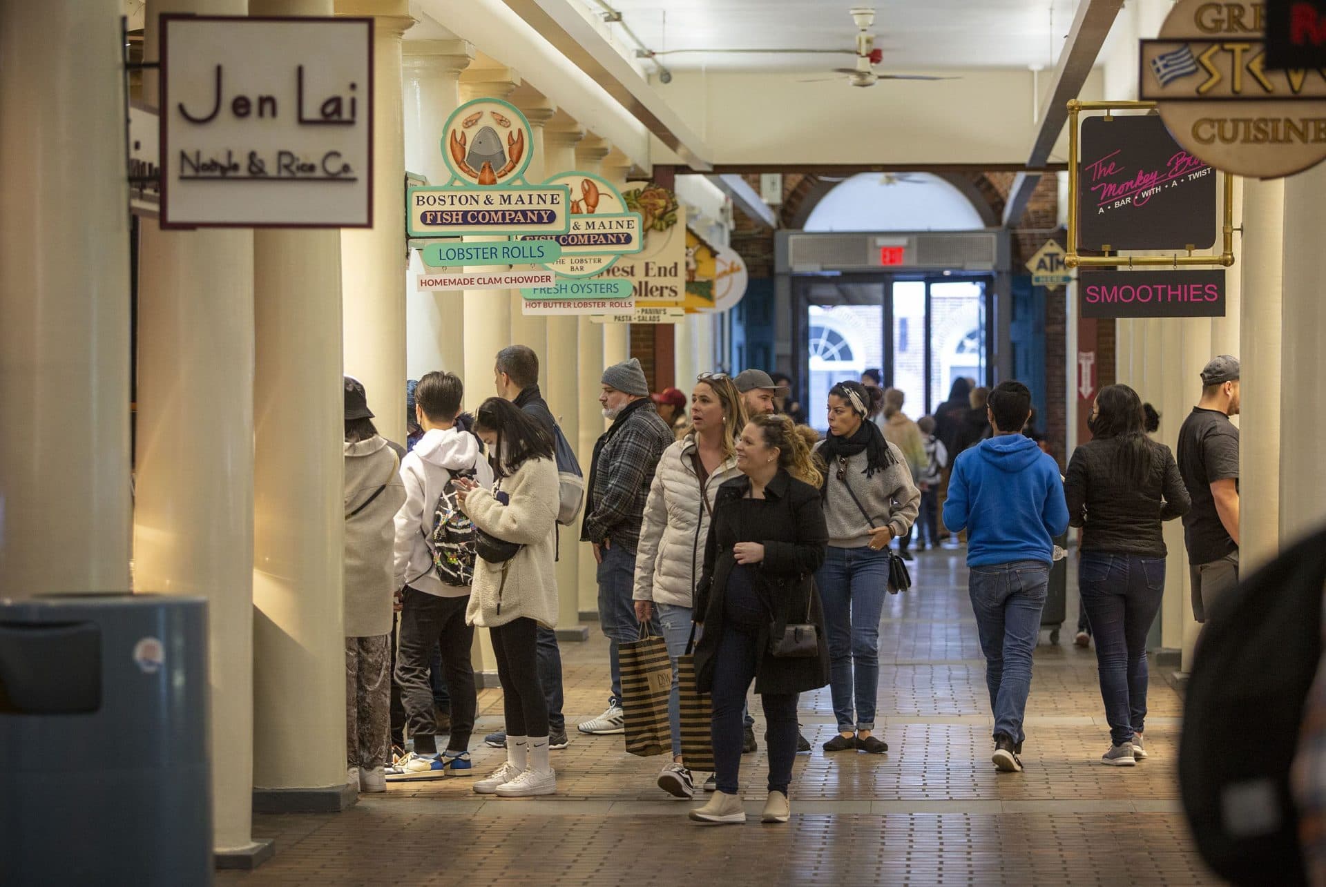 Visitor walk through Quincy Market at Faneuil Hall Marketplace. (Robin Lubbock/WBUR)