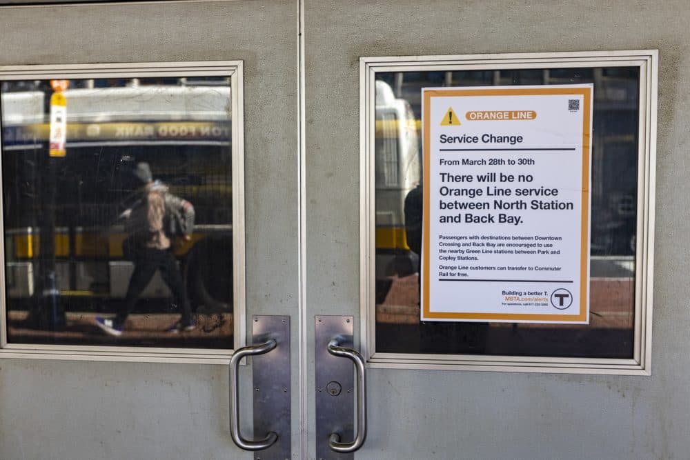 A sign on the door of the MBTA Haymarket Station informing commuters of the disruption of service caused by the accident. Shuttle buses will replace service between North Station and Back Bay Station. (Jesse Costa/WBUR)