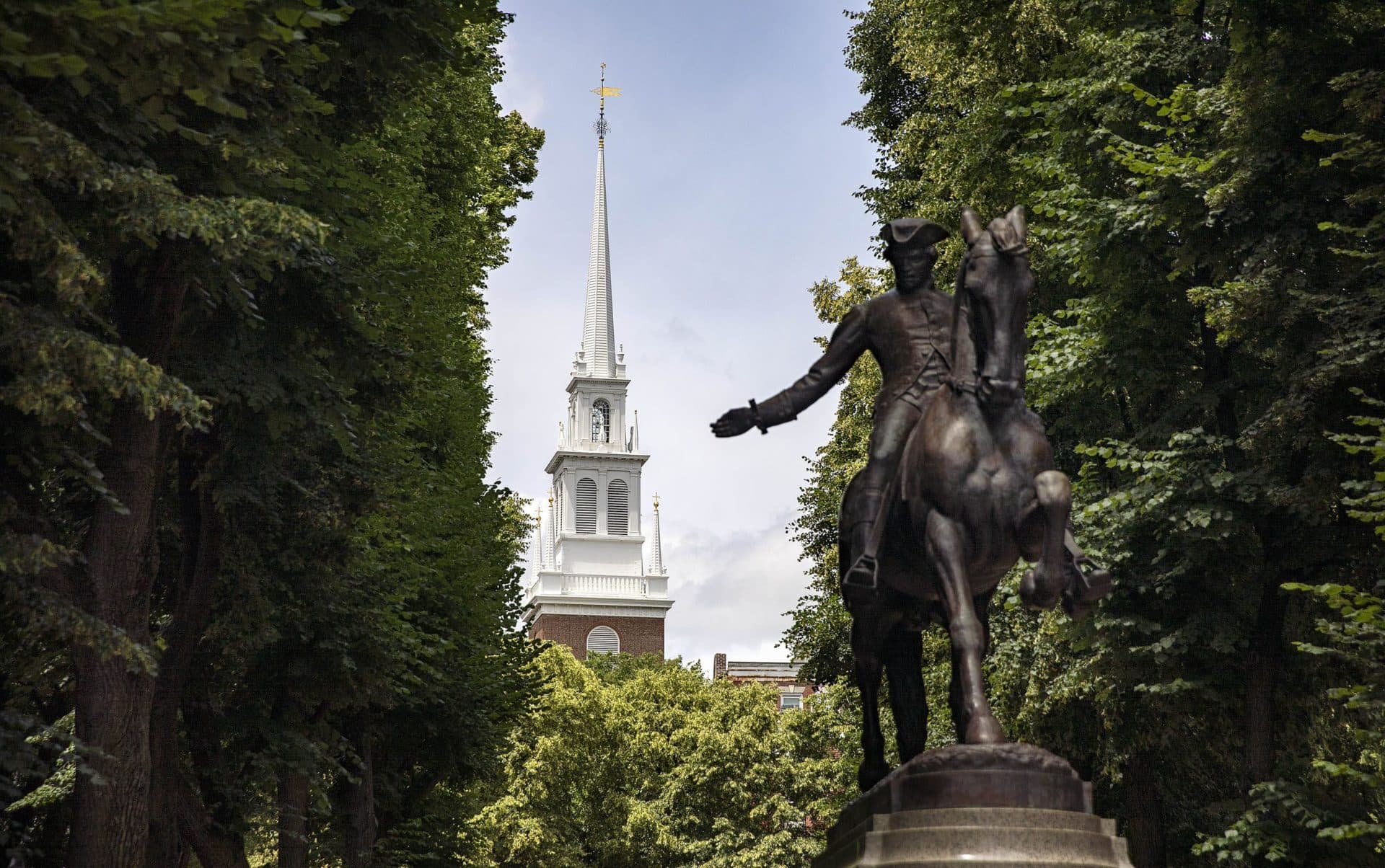A statue of Paul Revere in front of the Old North Church bell tower in Boston's North End. The photo was taken by Robin Lubbock for WBUR.