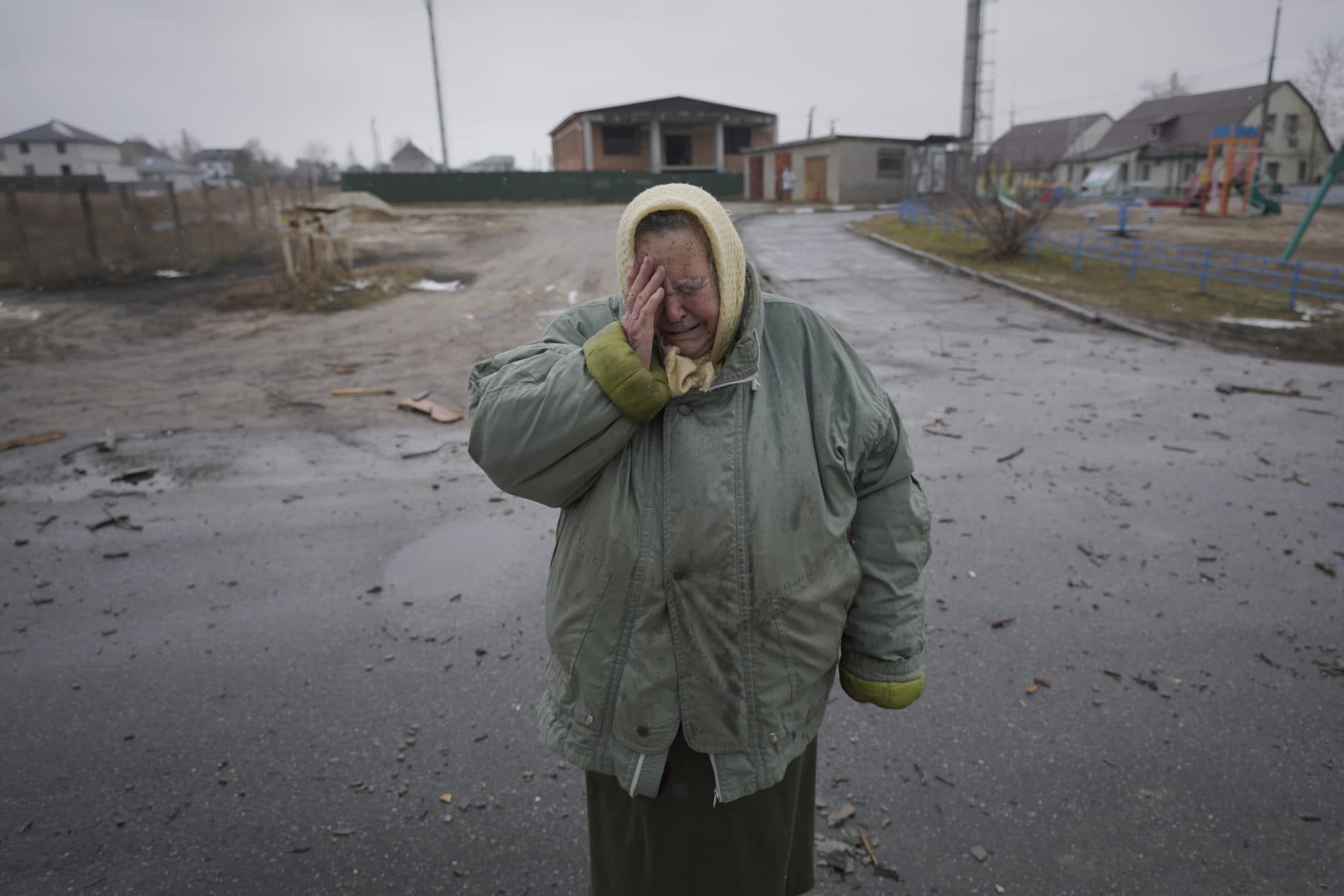A woman cries outside houses damaged by a Russian airstrike, according to locals, in Gorenka, outside the capital Kyiv, Ukraine, March 2. (Vadim Ghirda/AP)