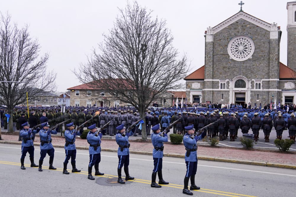 A three-volley salute is fired during the funeral of Massachusetts State Police Trooper Tamar Bucci, outside Saint Anthony of Padua church, March 9, 2022, in Revere. (Charles Krupa/AP)