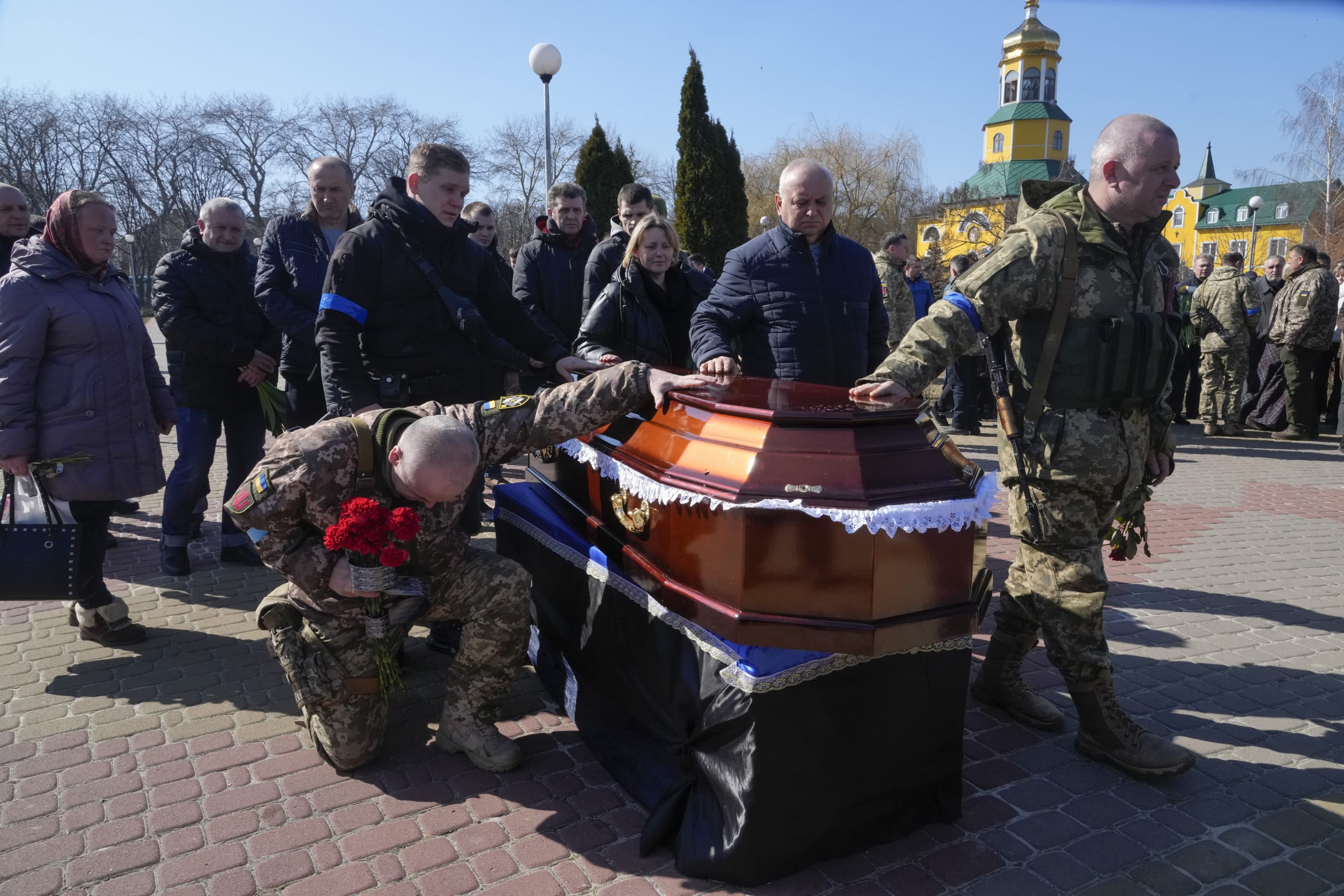Ukrainian soldiers pay the last tribute to colonel Valeriy Gudz who was killed in a battle against the Russian invaders in a cemetery in the town of Boryspil close to capital Kyiv, Ukraine, Tuesday, March 15, 2022. (Efrem Lukatsky/AP)