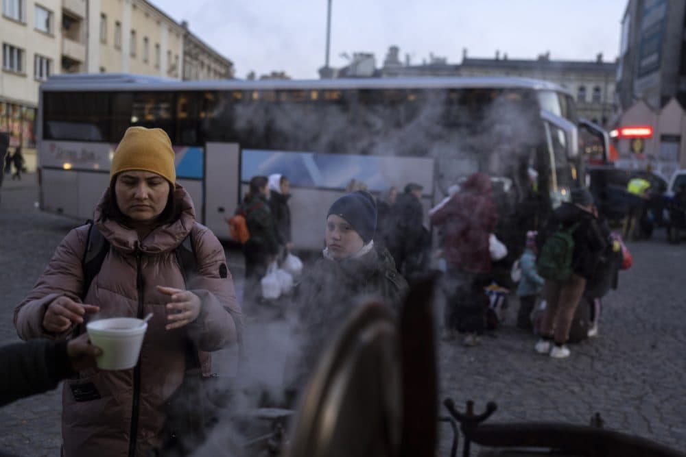A Ukrainian refugee takes a cup of soup at the train station in Przemysl, Poland. Poland has admitted some 1.95 million refugees fleeing war and Russian aggression on Ukraine. (Petros Giannakouris/AP)