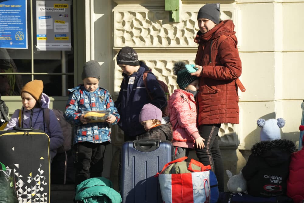 Refugees wait for a transport after fleeing the war in Ukraine at a railway station in Przemysl, Poland on Thursday, March 24, 2022. (Sergei Grits/AP)