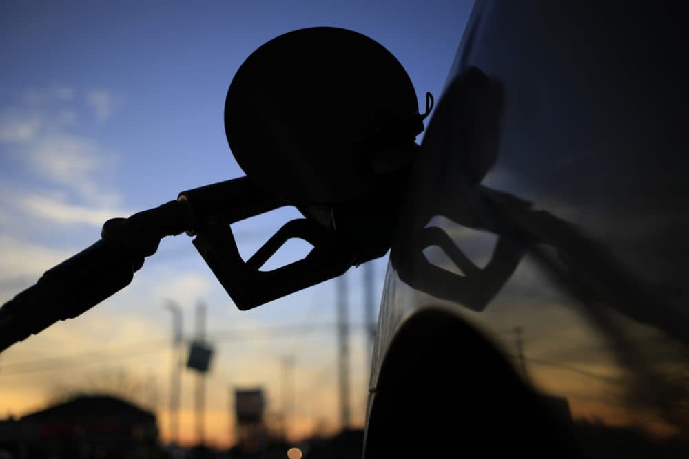 A fuel pump nozzle in a vehicle gas tank. (Luke Sharrett/Bloomberg via Getty)