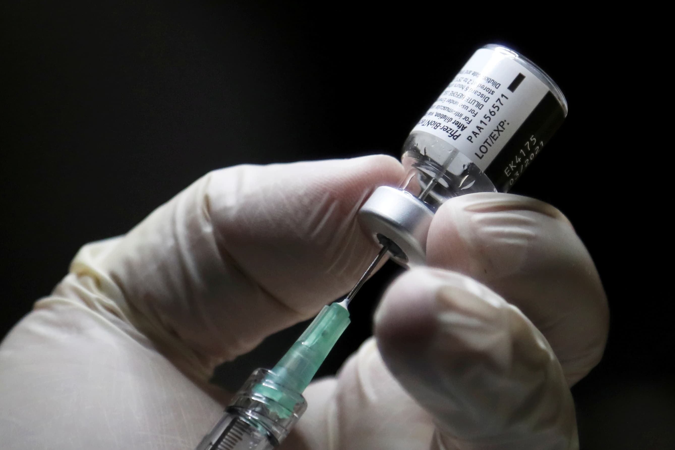 A healthcare worker prepares to administer a Pfizer/BioNTEch coronavirus vaccine (Carlos Osorio/POOL/AFP via Getty Images)