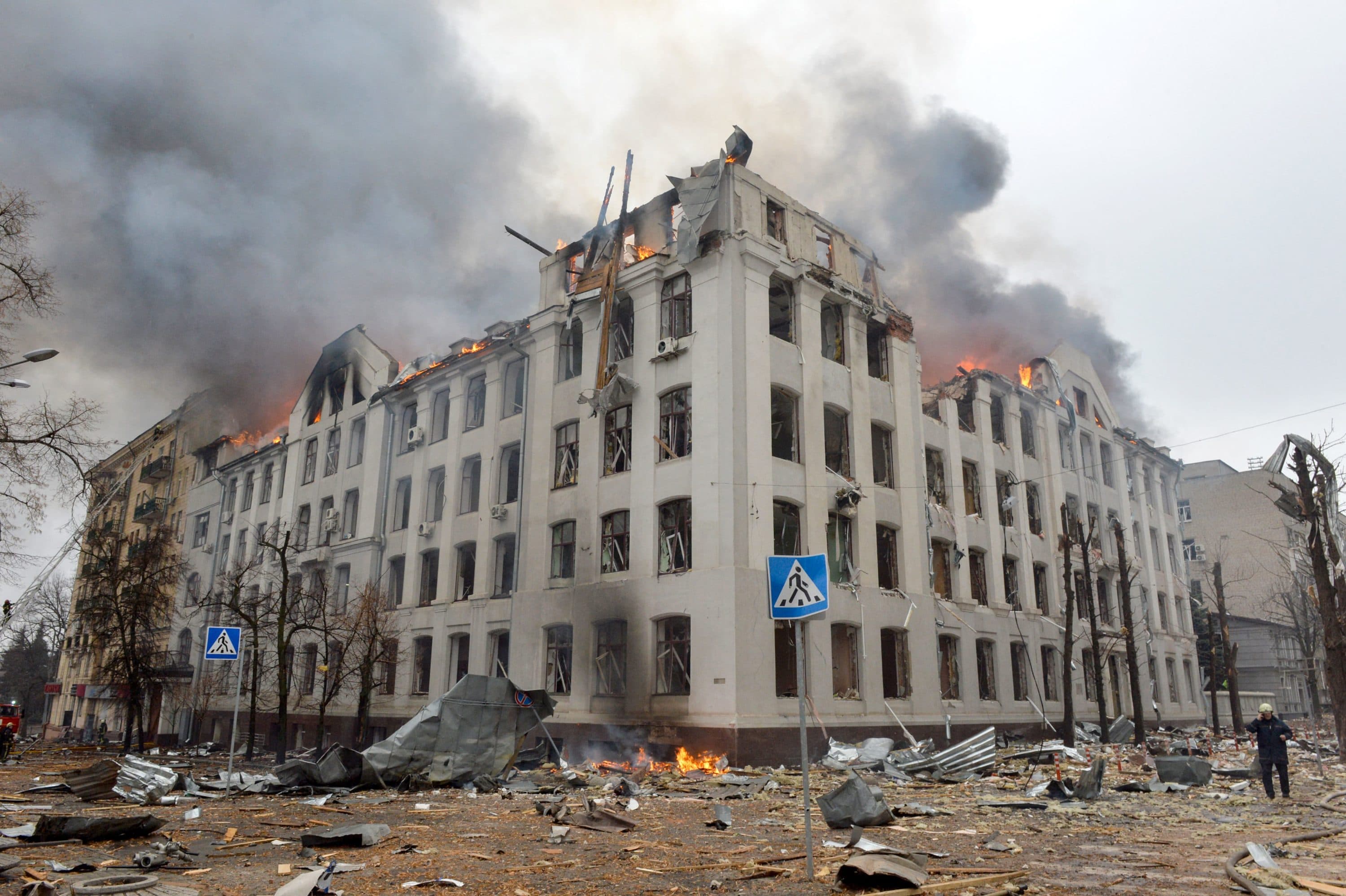 Firefighters work to contain a fire at the Economy Department building of Karazin Kharkiv National University, allegedly hit during recent shelling by Russia, on March 2, 2022. (Photo by Sergey Bobok/AFP via Getty Images)
