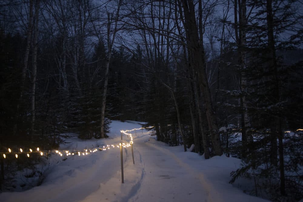 There are so many big lessons we have learned during two years living and dying with COVID-19, writes Eileen McNamara. But there have been smaller lessons, too, no less important. In this photo, Christmas lights decorate the path of a homemade luge in a farmer's field on December 26, 2021 outside of the town of Woodstock, New Hampshire. (Andrew Lichtenstein/Corbis via Getty Images)