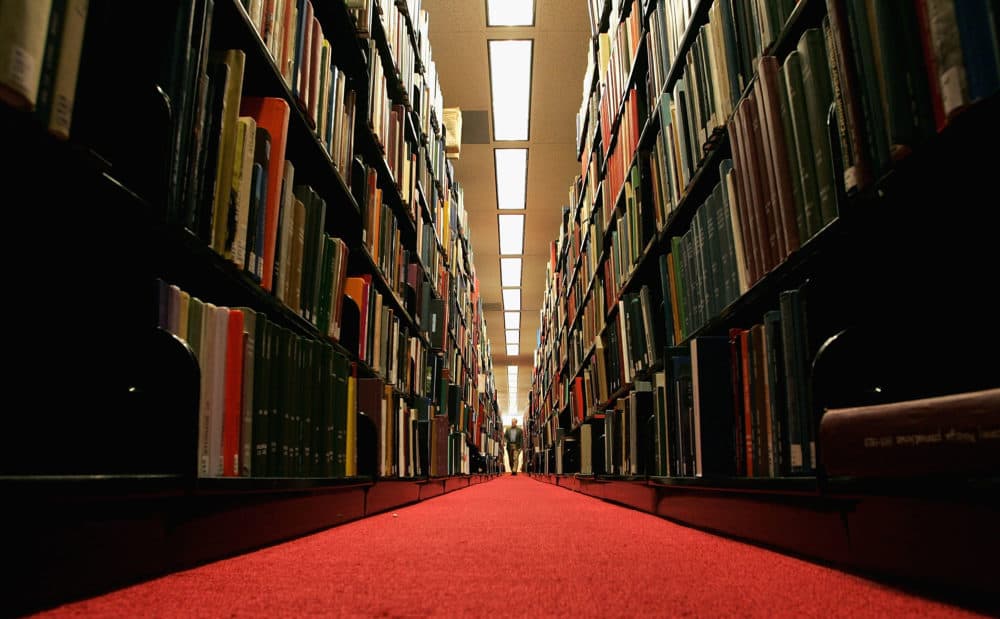 A man browses through books at the Cecil H. Green on the Stanford University Campus. (Justin Sullivan/Getty Images)