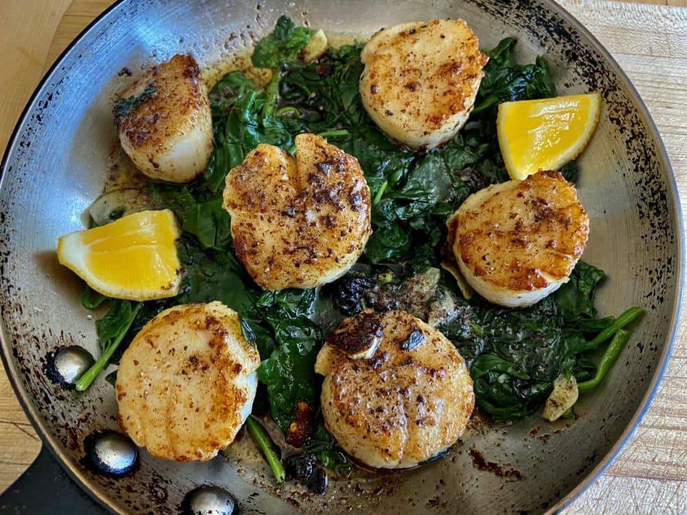 Sauteed scallops with spring spinach with brown butter-lemon sauce. (Kathy Gunst)