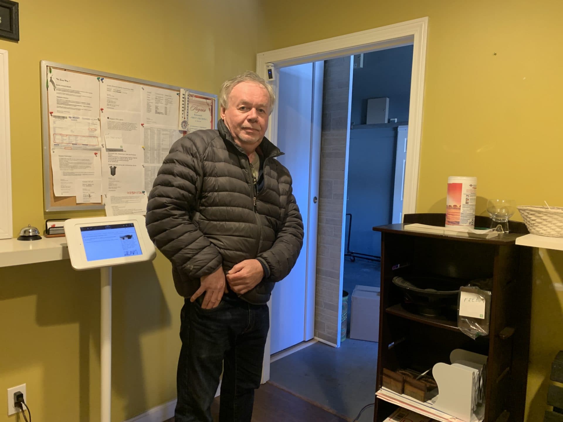 Roman Malko owns Bosmix, a Stoughton-based shipping company that specializes in Ukraine. He said his phone is ringing constantly with people trying to deliver aid packages for the country. (Simón Rios/WBUR)
