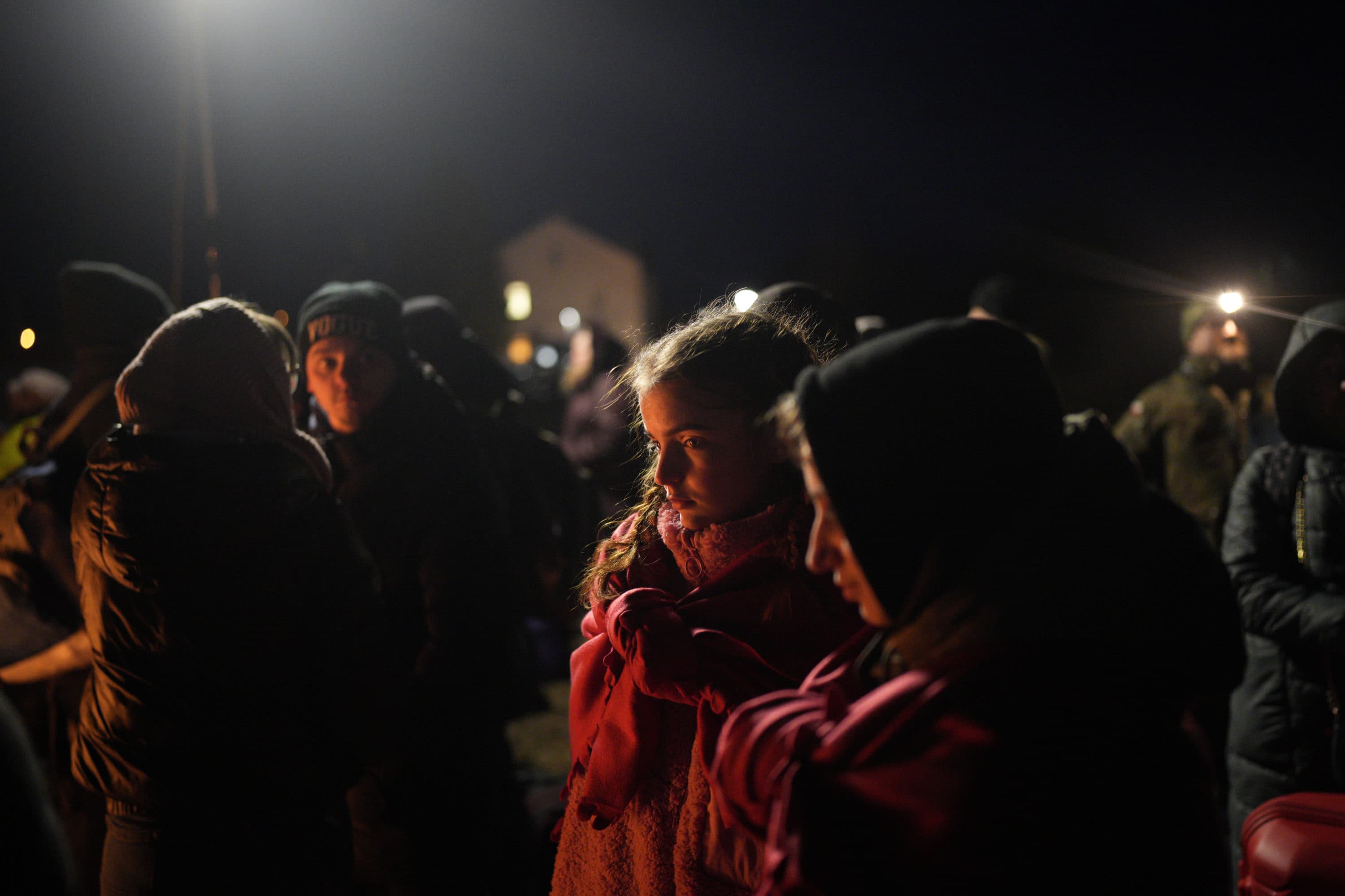 Refugees fleeing war in neighboring Ukraine gather at the Medyka border crossing, Poland, Thursday, March 10, 2022. (Daniel Cole/AP)