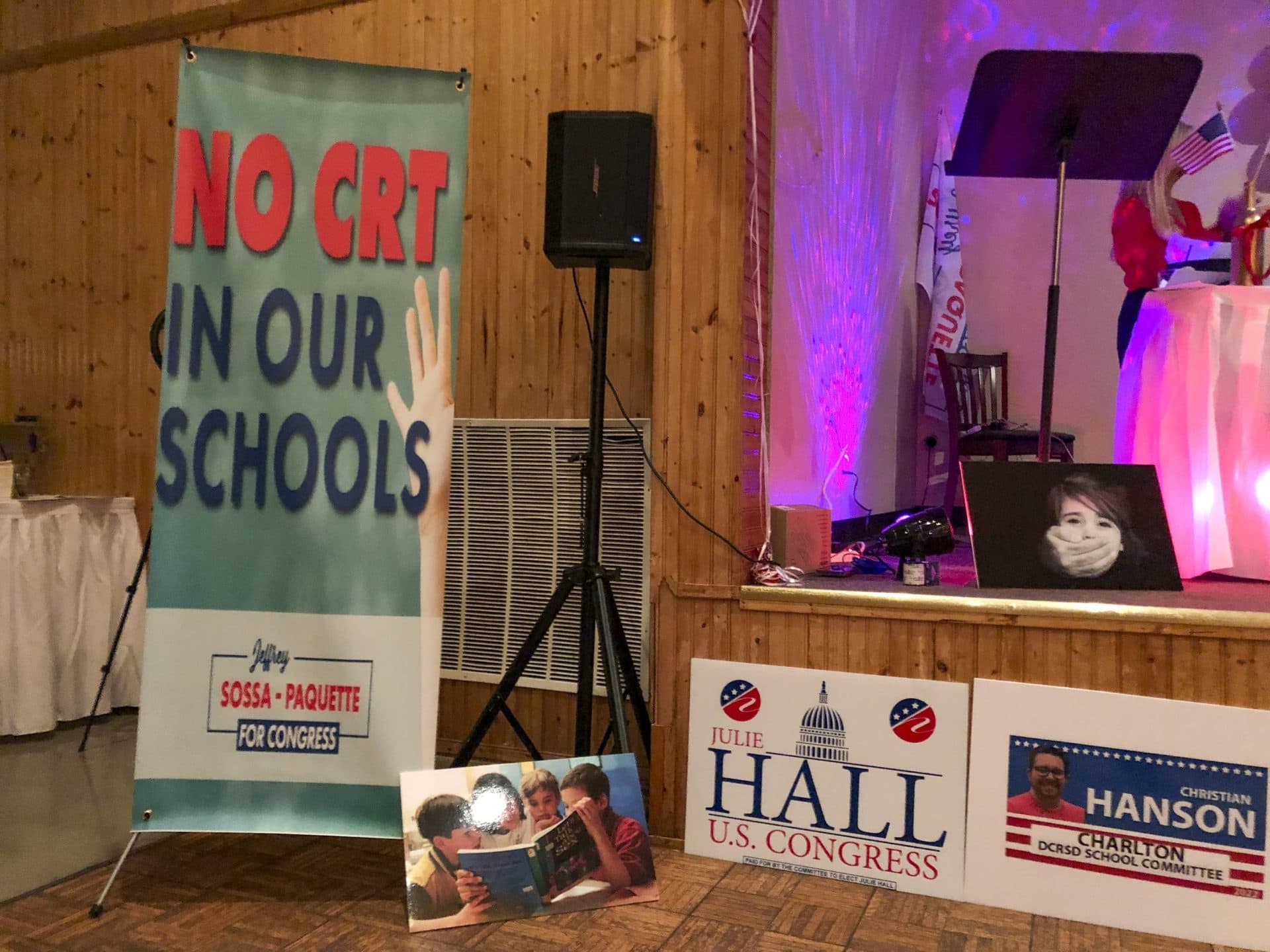 An anti-&quot;CRT,&quot; or critical race theory, sign at a forum for Republican political candidates to speak about public schools in Auburn on Jan. 13. (Wilder Fleming/WBUR)