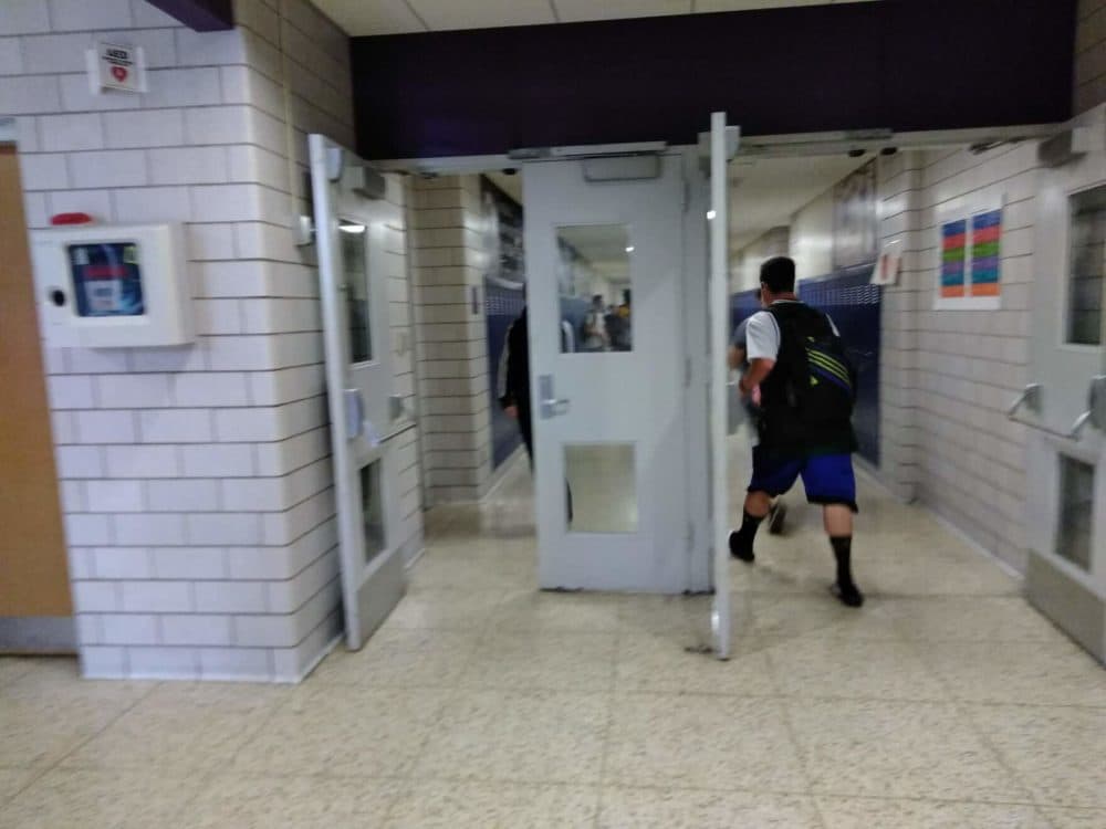 A student going to class in Holyoke High School, which accepted students displaced by Hurricane Maria. (Jill Kaufman/NEPM)