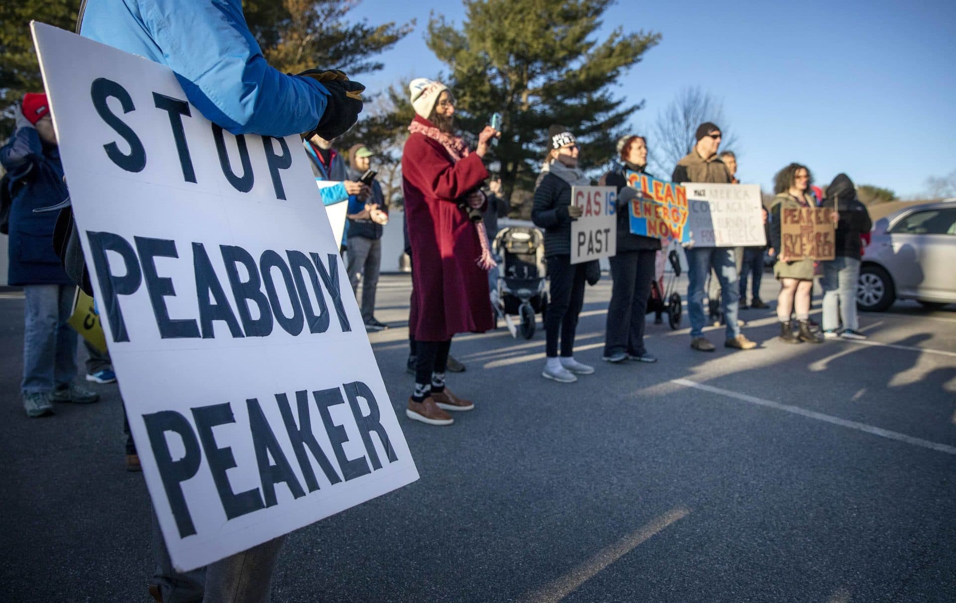 Protesters at a march to stop the construction of a new gas peaker power plant in Peabody. (Robin Lubbock/WBUR)