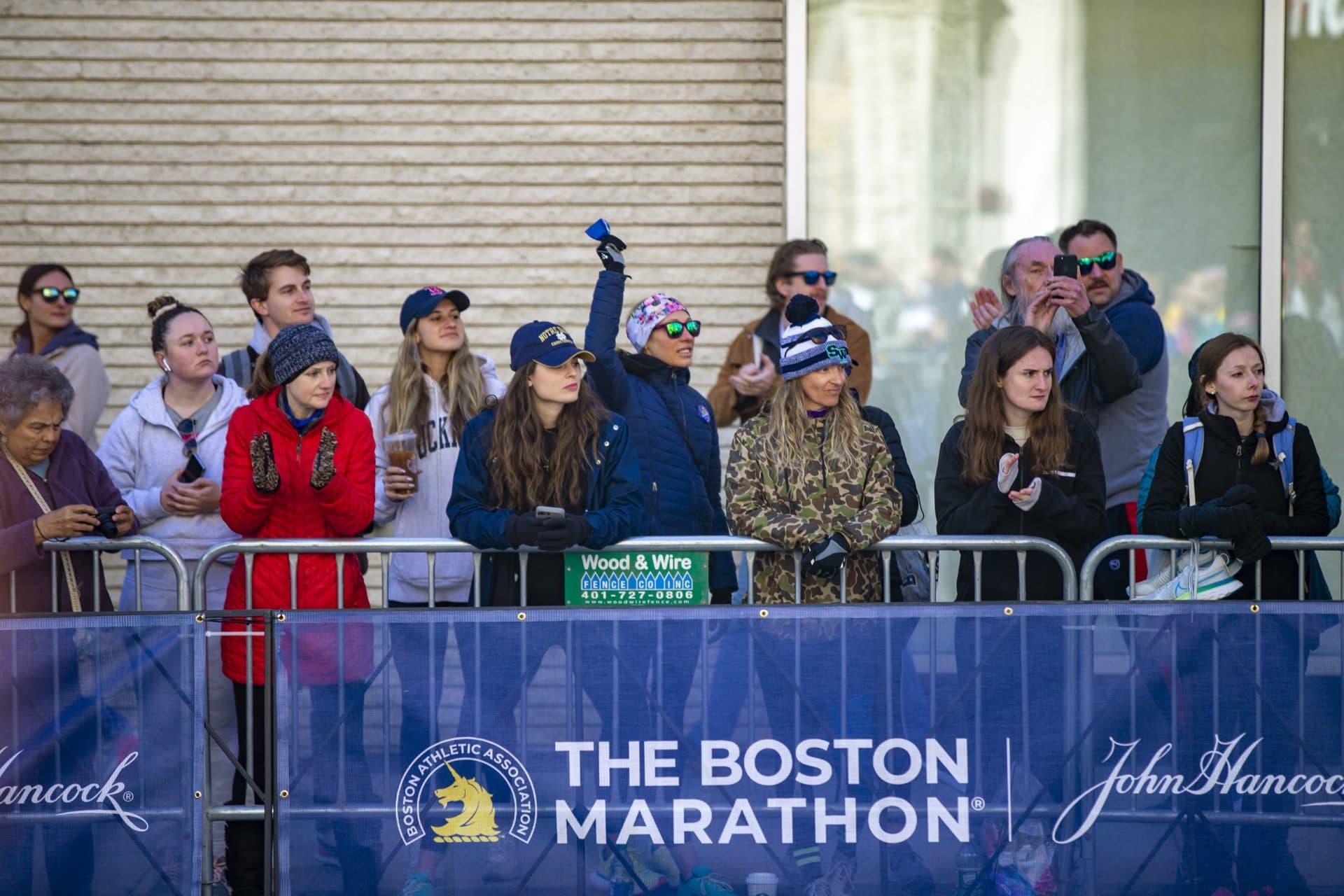 Spectators cheer for the wheelchair racers as the approach the finish line on Boylston street. (Jesse Costa/WBUR)