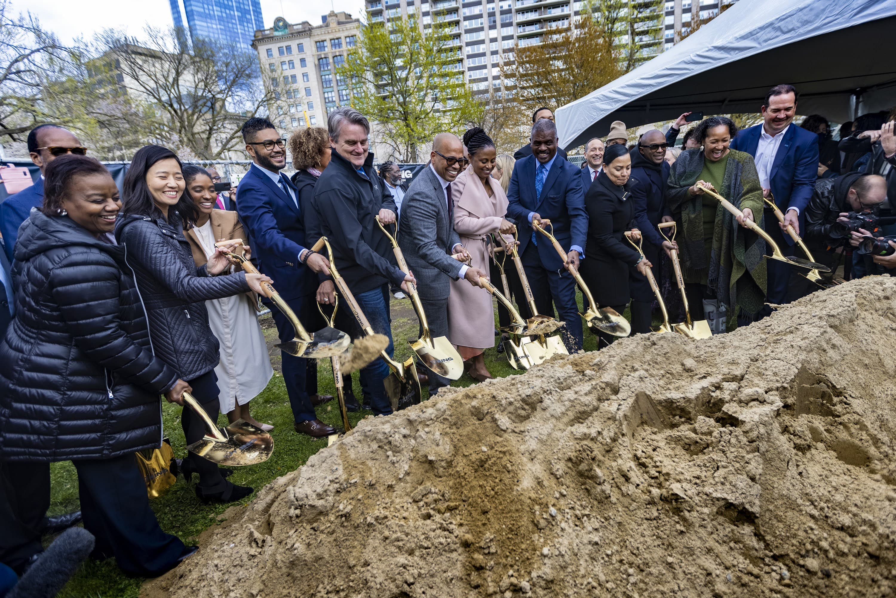 Local politicians, dignitaries and founding members of King Boston ceremoniously break ground for the King Boston memorial, &quot;The Embrace,&quot; at the Boston Common. (Jesse Costa/WBUR)