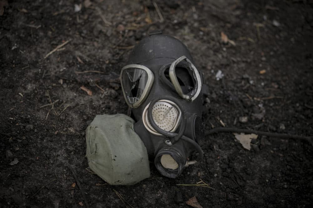 A damaged gas mask lies on the pavement at a Russian position which was overran by Ukrainian forces, outside Kyiv, Ukraine, March 31, 2022. (Vadim Ghirda/AP)