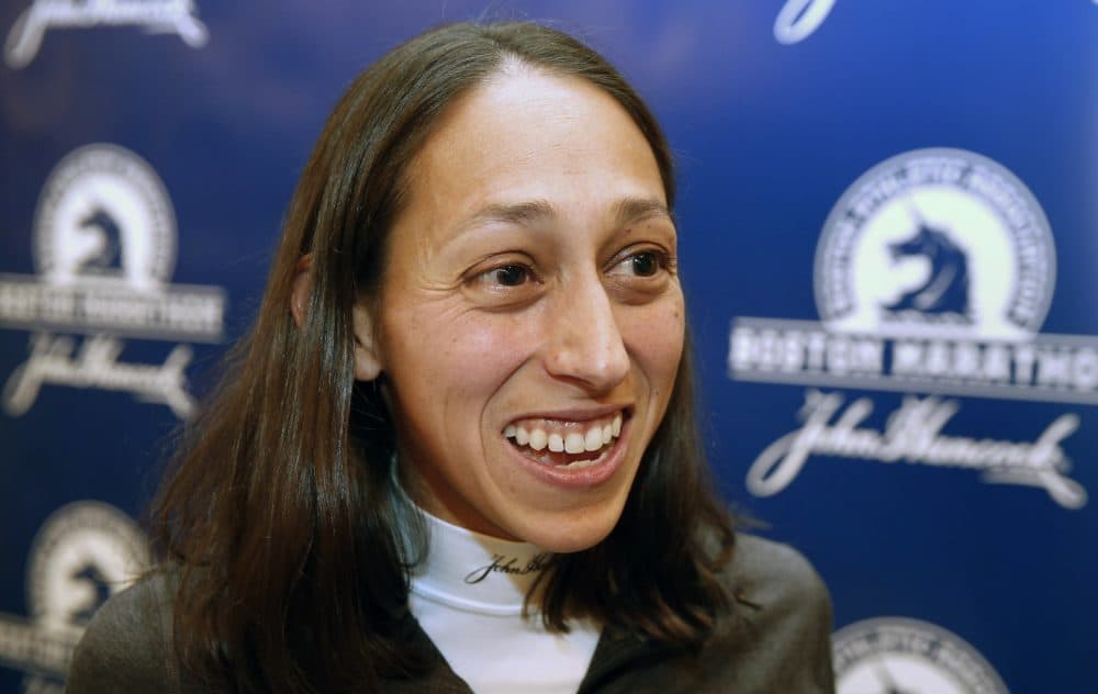In file photo from April 15, 2016, Des Linden speaks with a reporter during a media availability prior to the 120th running of the Boston Marathon in Boston. (Michael Dwyer/AP)