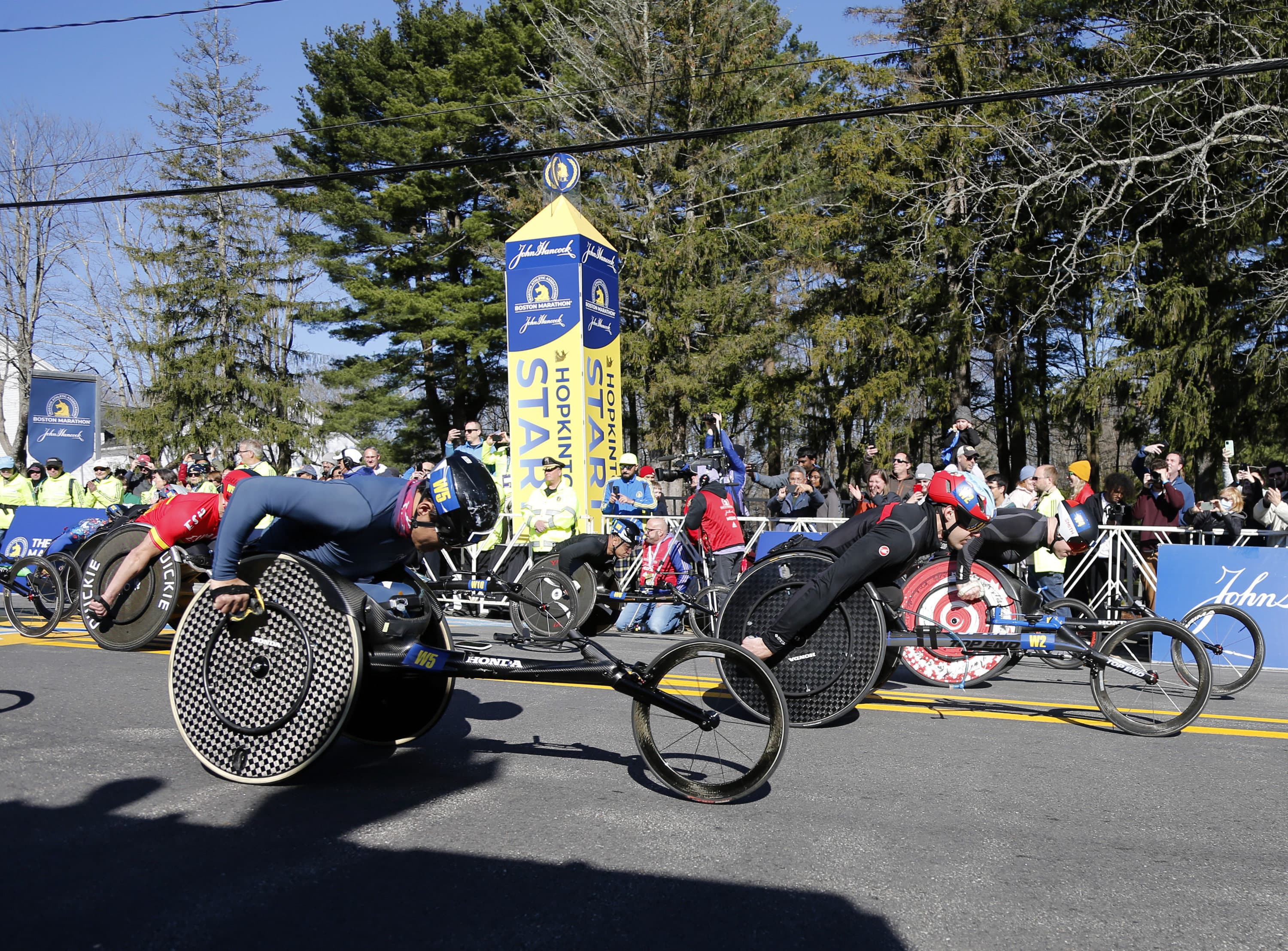 The men's wheelchair division breaks from the starting line of the 126th Boston Marathon, Monday, April 18, 2022, in Hopkinton, Mass. (Mary Schwalm/AP)