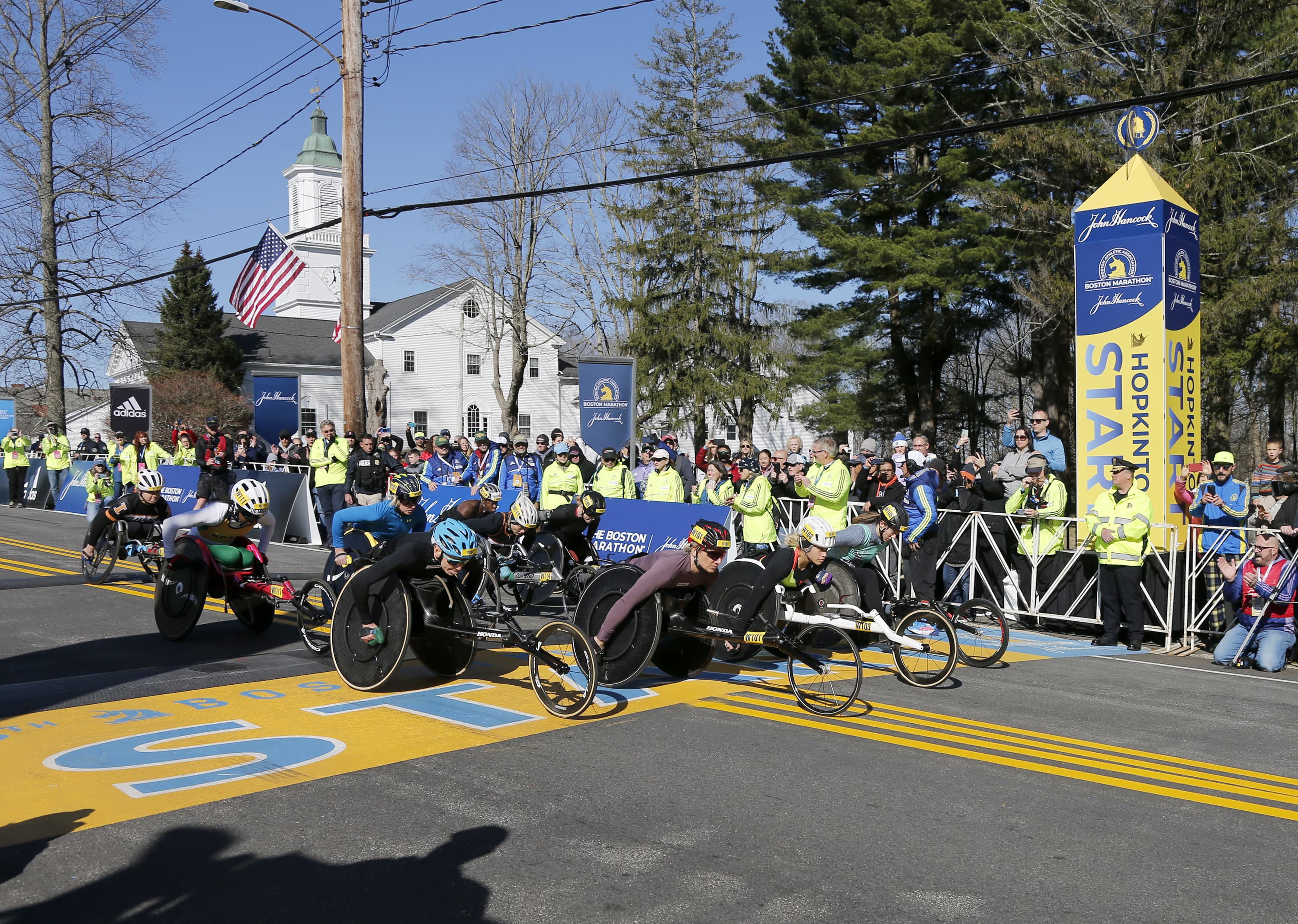 The women's wheelchair division breaks from the starting line of the 126th Boston Marathon, Monday, April 18, 2022, in Hopkinton, Mass. (Mary Schwalm/AP)