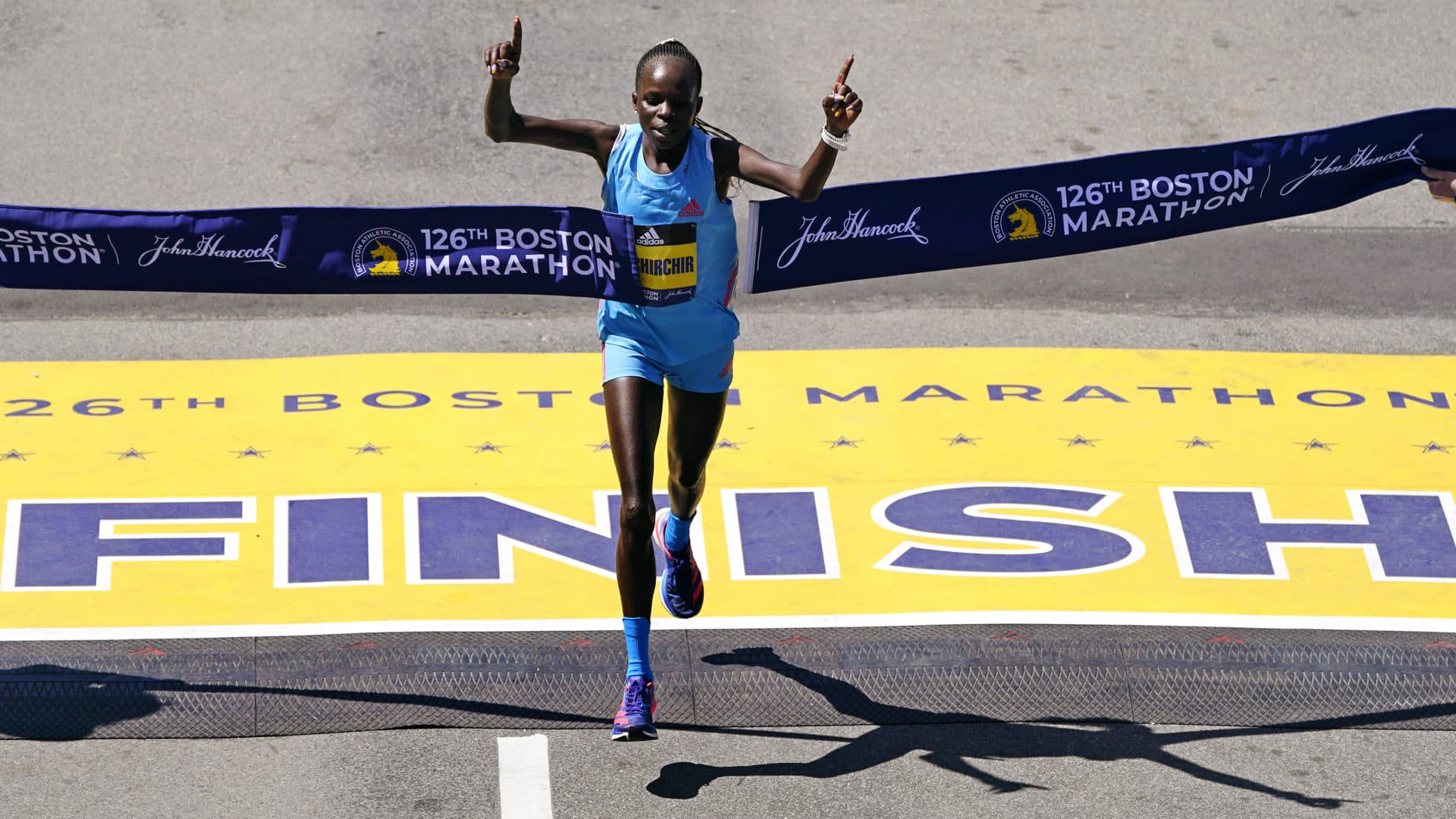 Peres Jepchirchir, of Kenya, breaks the tape to win the women's division of the 2022 Boston Marathon. (Charles Krupa/AP)