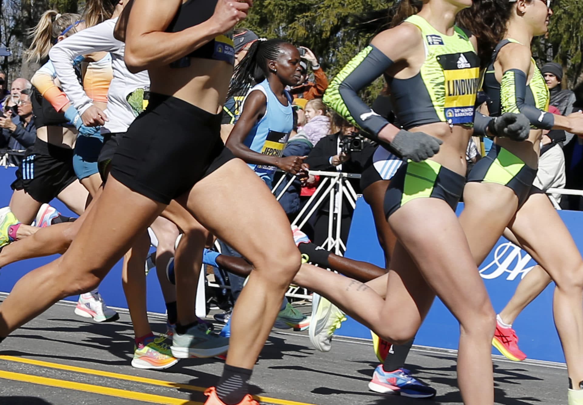 Peres Jepchirchir, of Kenya, center, heads out in the middle of the elite women's pack at the start of the 126th Boston Marathon. (Mary Schwalm/AP)